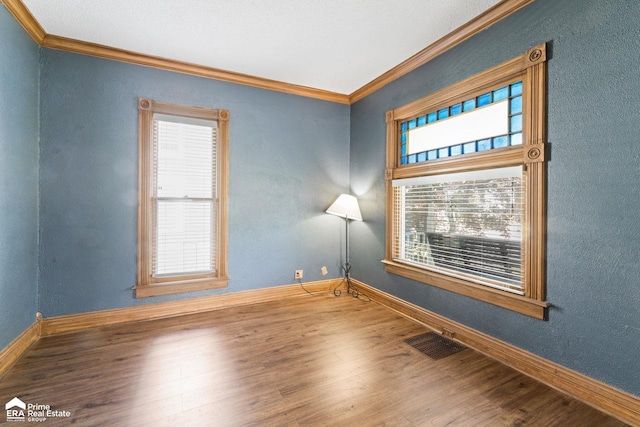 320 E Main St, Flushing, MI 48433 - spare room with crown molding, wood finished floors, and a textured wall