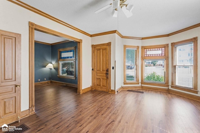 320 E Main St, Flushing, MI 48433 - foyer featuring wood finished floors, a textured ceiling, ceiling fan, and crown molding