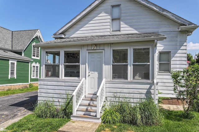 320 E Main St, Flushing, MI 48433 - view of front of property featuring entry steps and a shingled roof