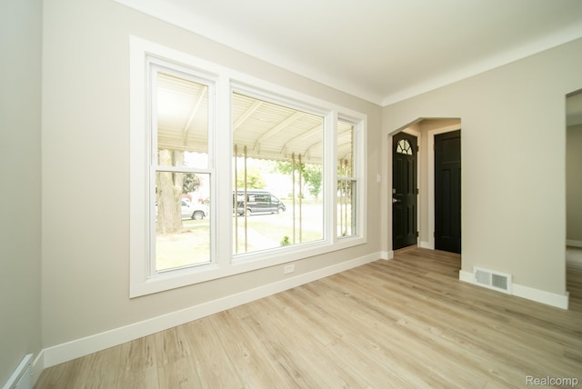 1922 N Wilson Ave, Royal Oak, MI 48073 - spare room with light wood-type flooring and arched walkways