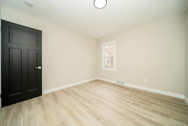1922 N Wilson Ave, Royal Oak, MI 48073 - unfurnished room with wood finished floors and a smoke detector