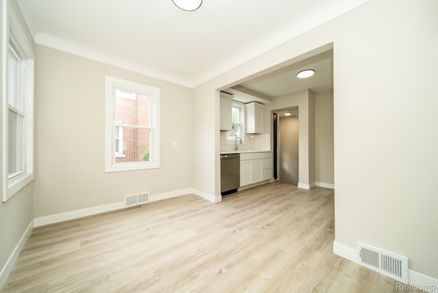 1922 N Wilson Ave, Royal Oak, MI 48073 - unfurnished living room featuring light wood-style floors and a sink