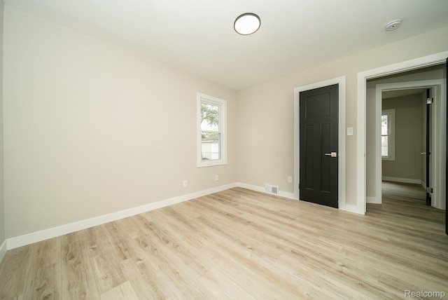 1922 N Wilson Ave, Royal Oak, MI 48073 - empty room with light wood-type flooring and a smoke detector