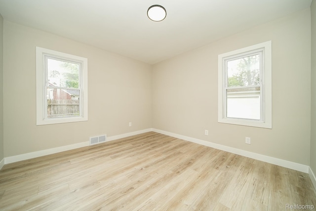 1922 N Wilson Ave, Royal Oak, MI 48073 - spare room featuring wood finished floors and baseboards