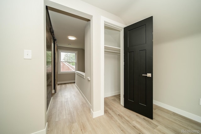 1922 N Wilson Ave, Royal Oak, MI 48073 - hallway with a barn door and light wood finished floors