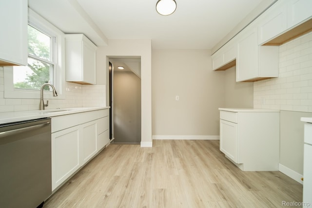 1922 N Wilson Ave, Royal Oak, MI 48073 - kitchen featuring dishwasher, light countertops, and backsplash