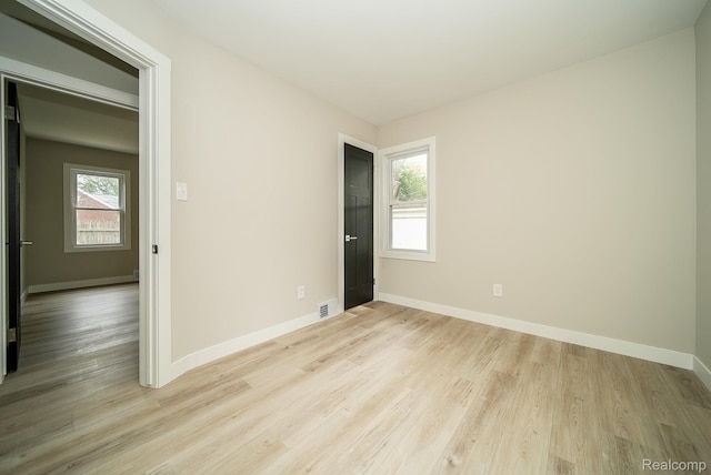 1922 N Wilson Ave, Royal Oak, MI 48073 - empty room featuring light wood-type flooring and plenty of natural light