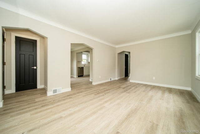 1922 N Wilson Ave, Royal Oak, MI 48073 - unfurnished living room featuring light wood-style floors and arched walkways