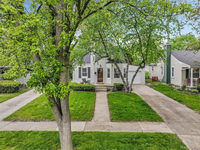 1605 N Vermont Ave, Rochester, MI 48067 - view of front of home featuring concrete driveway and a front lawn