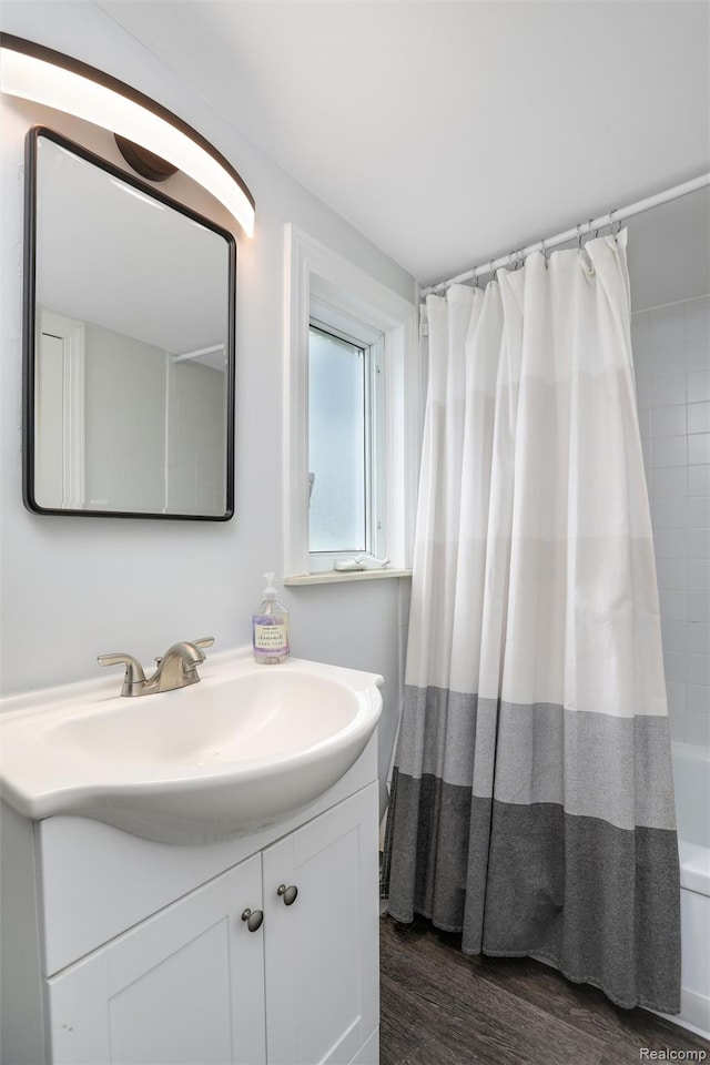 1605 N Vermont Ave, Rochester, MI 48067 - full bathroom with vanity, wood finished floors, and shower / bath combination with curtain