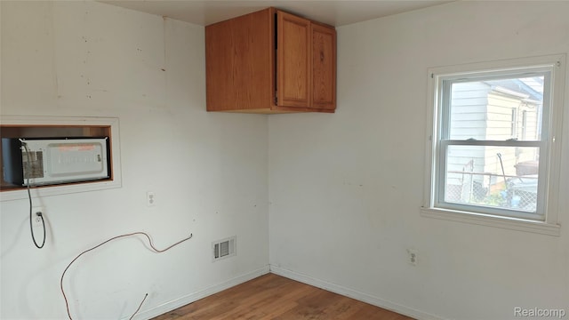 5157 Niagara St, Wayne, MI 48184 - laundry area with light wood finished floors and baseboards