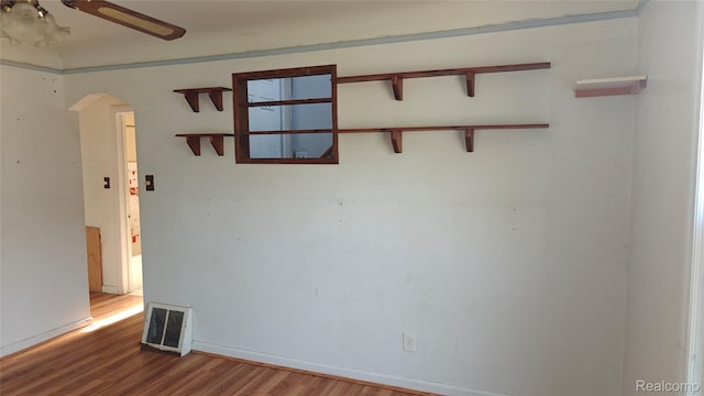 5157 Niagara St, Wayne, MI 48184 - spare room with wood finished floors, arched walkways, and ceiling fan