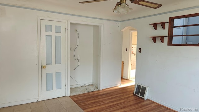 5157 Niagara St, Wayne, MI 48184 - unfurnished room featuring ceiling fan, arched walkways, and wood finished floors