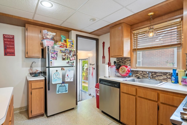 11372 Riverdale Ave, Redford, MI 48239 - kitchen featuring appliances with stainless steel finishes, decorative backsplash, light countertops, decorative light fixtures, and a paneled ceiling