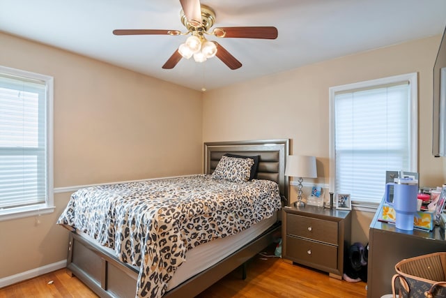 11372 Riverdale Ave, Redford, MI 48239 - bedroom with multiple windows, light wood-style floors, and ceiling fan