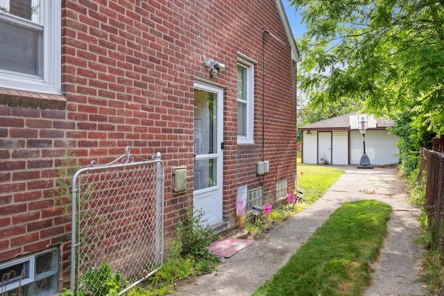 11372 Riverdale Ave, Redford, MI 48239 - view of side of home with brick siding and a detached garage