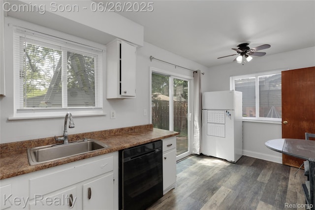 9468 Washington St, Romulus, MI 48174 - kitchen featuring freestanding refrigerator, dishwasher, dark wood-style floors, white cabinets, and ceiling fan