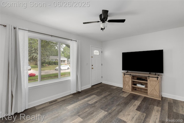 9468 Washington St, Romulus, MI 48174 - unfurnished living room with wood finished floors and a ceiling fan