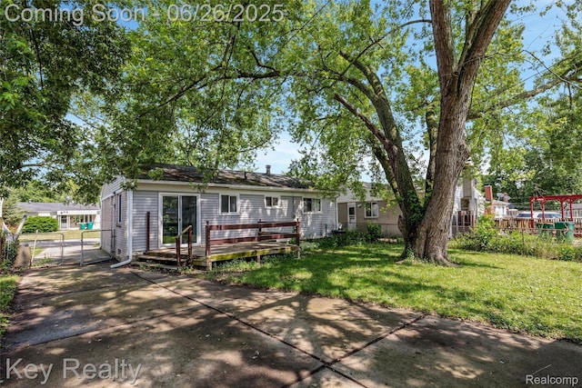 9468 Washington St, Romulus, MI 48174 - rear view of house featuring a deck