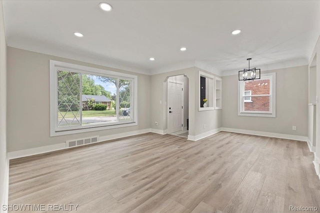 24611 Kenosha St, Oak Park, MI 48237 - unfurnished living room featuring light wood-style floors, a chandelier, and recessed lighting