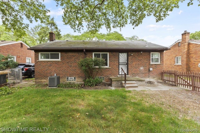 24611 Kenosha St, Oak Park, MI 48237 - back of house with brick siding, a chimney, and roof with shingles
