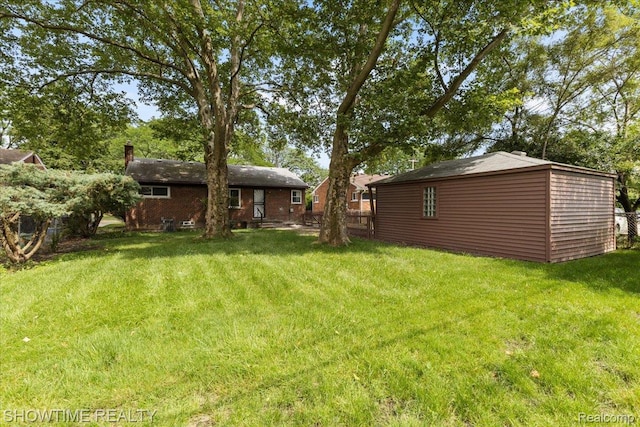 24611 Kenosha St, Oak Park, MI 48237 - view of grassy yard with an outbuilding