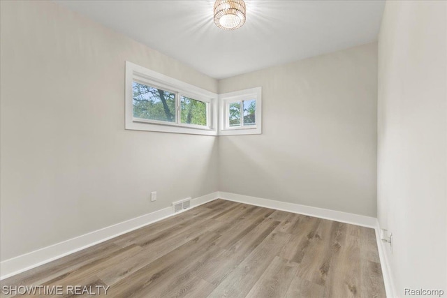24611 Kenosha St, Oak Park, MI 48237 - spare room with baseboards and wood finished floors
