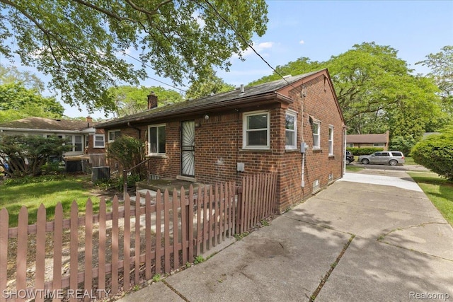 24611 Kenosha St, Oak Park, MI 48237 - view of front of property with brick siding and a chimney