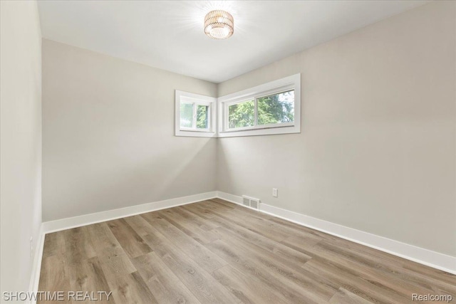 24611 Kenosha St, Oak Park, MI 48237 - unfurnished room featuring baseboards and wood finished floors