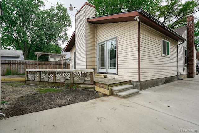3911 Thomas Ave, Berkley, MI 48072 - view of home's exterior featuring a chimney and a patio area