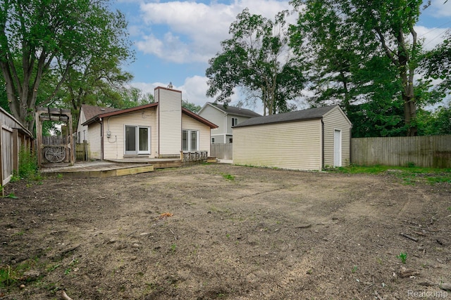 3911 Thomas Ave, Berkley, MI 48072 - back of property with a fenced backyard, a storage shed, a wooden deck, and a chimney