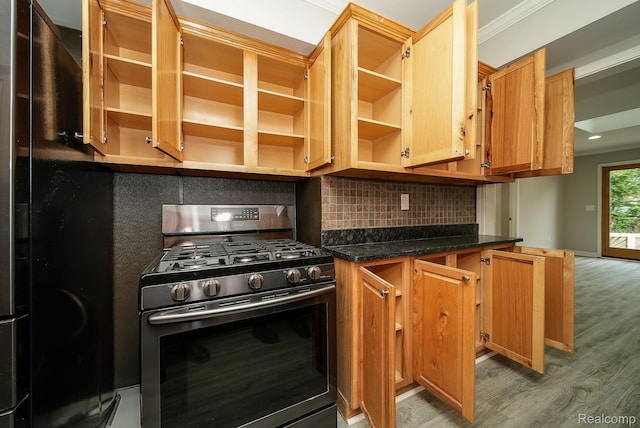 3911 Thomas Ave, Berkley, MI 48072 - kitchen with stainless steel range with gas stovetop, open shelves, light wood-style flooring, and backsplash