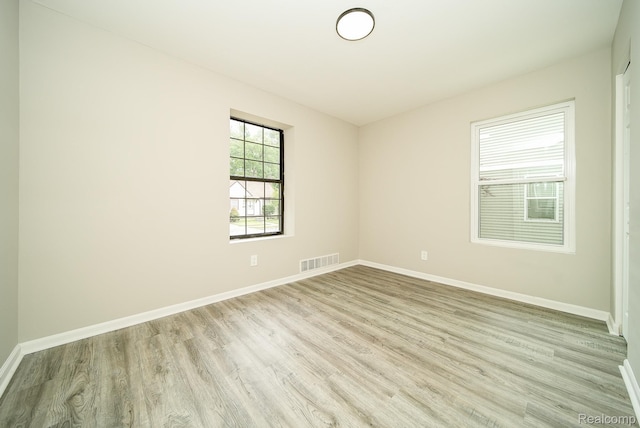 3911 Thomas Ave, Berkley, MI 48072 - spare room featuring light wood-style floors and baseboards