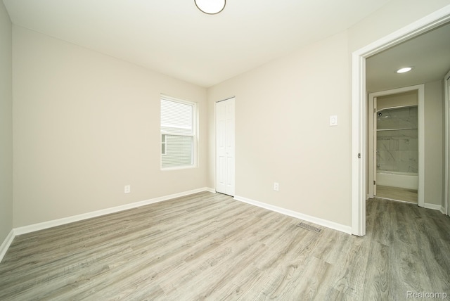 3911 Thomas Ave, Berkley, MI 48072 - unfurnished bedroom featuring light wood finished floors, a closet, and recessed lighting