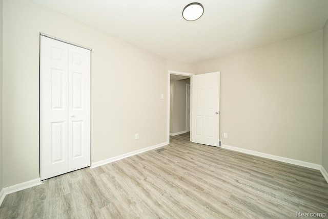 3911 Thomas Ave, Berkley, MI 48072 - unfurnished bedroom featuring light wood-style floors and a closet