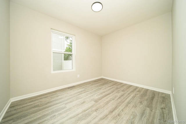 3911 Thomas Ave, Berkley, MI 48072 - spare room featuring light wood finished floors and baseboards
