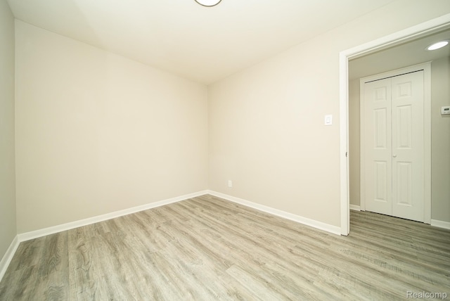 3911 Thomas Ave, Berkley, MI 48072 - spare room with light wood-style flooring and baseboards