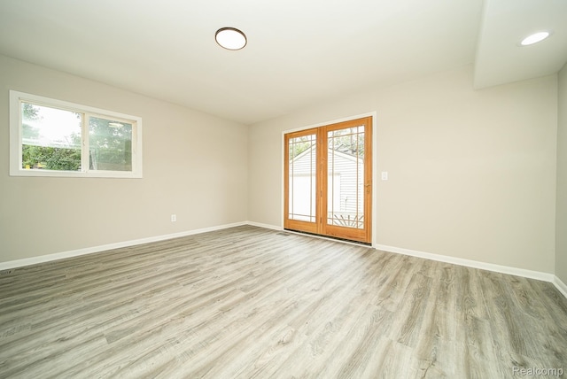 3911 Thomas Ave, Berkley, MI 48072 - spare room featuring healthy amount of natural light, light wood-style floors, and french doors