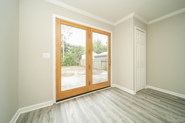 3911 Thomas Ave, Berkley, MI 48072 - doorway to outside featuring light wood-type flooring and ornamental molding