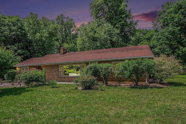 10158 US Highway 31, Berrien Springs, MI 49103 - ranch-style house with a chimney, a front yard, and brick siding
