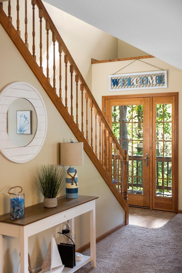 1724 N Ridge Rd, Mears, MI 49436 - carpeted foyer with stairs and a high ceiling