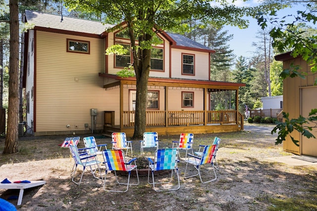 1724 N Ridge Rd, Mears, MI 49436 - rear view of house with a deck and roof with shingles