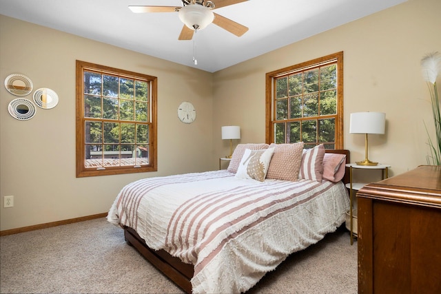 1724 N Ridge Rd, Mears, MI 49436 - bedroom with carpet flooring, multiple windows, and a ceiling fan