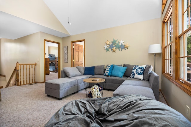1724 N Ridge Rd, Mears, MI 49436 - carpeted living area featuring high vaulted ceiling