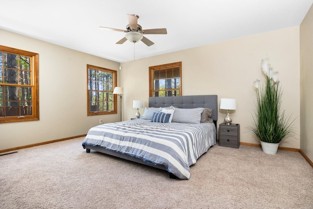 1724 N Ridge Rd, Mears, MI 49436 - carpeted bedroom with baseboards and a ceiling fan