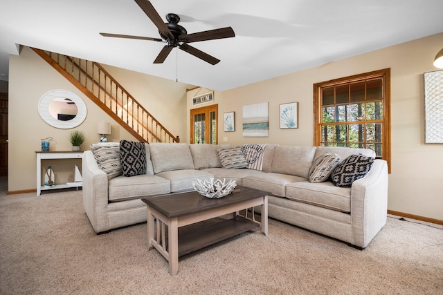 1724 N Ridge Rd, Mears, MI 49436 - living room featuring carpet flooring, a ceiling fan, and stairs
