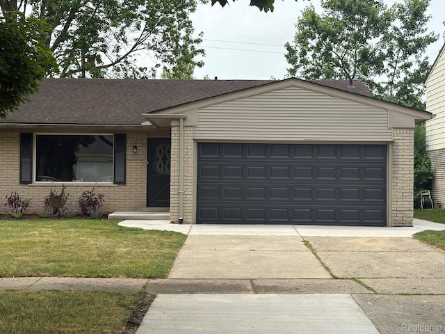 14671 Labelle St, Oak Park, MI 48237 - single story home with brick siding, a front yard, and a garage