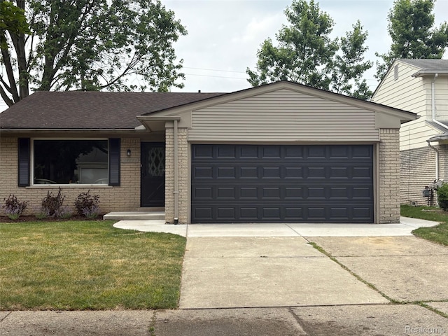14671 Labelle St, Oak Park, MI 48237 - single story home with brick siding, driveway, an attached garage, and a front yard