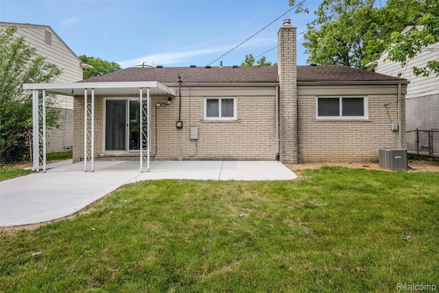 14671 Labelle St, Oak Park, MI 48237 - back of house with a patio area, a chimney, and brick siding