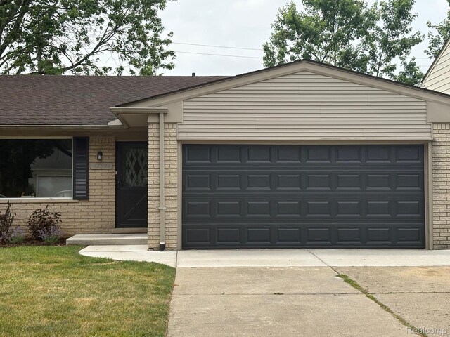 14671 Labelle St, Oak Park, MI 48237 - ranch-style house with brick siding, an attached garage, driveway, and a shingled roof